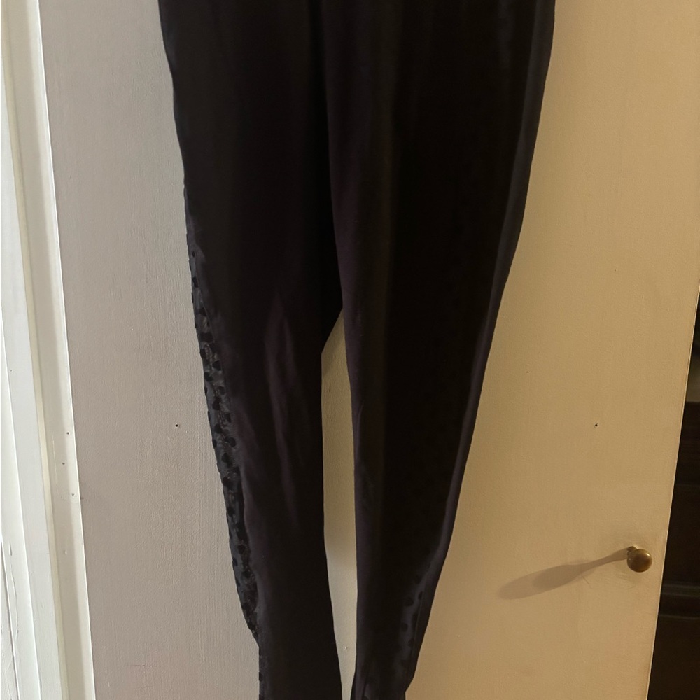 Torrid black leggings with  heart Side Detailing
